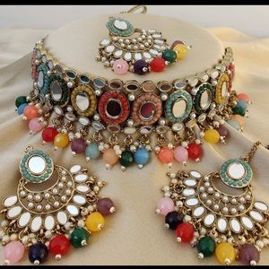 This is Indian Punjabi jewellery multicolour set with beautiful earrings and tik